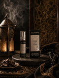 Parfum Fakhar Lattafa 10 ml pour homme, flacon roll-on argenté et son étui, ambiance boisée et lanterne dorée