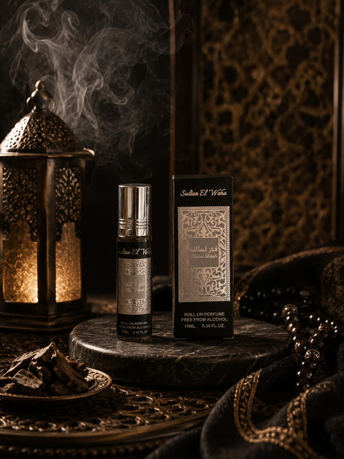Parfum Fakhar Lattafa 10 ml pour homme, flacon roll-on argenté et son étui, ambiance boisée et lanterne dorée